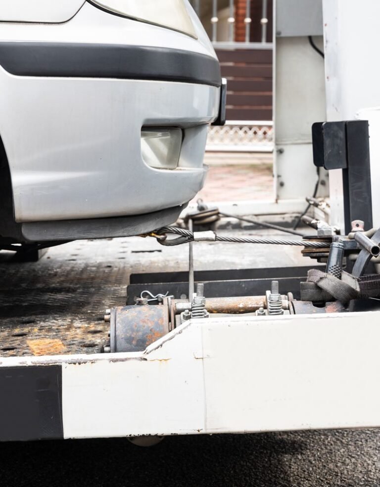 broken-down-car-towed-onto-flatbed-tow-truck-P9MJ6XG-1
